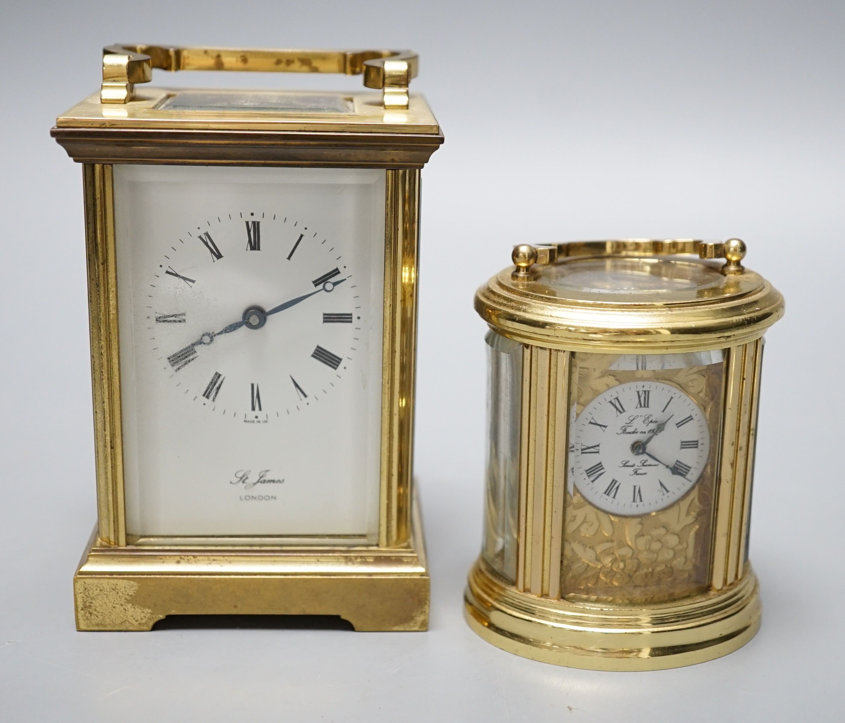 Two modern brass carriage timepieces, one oval cased